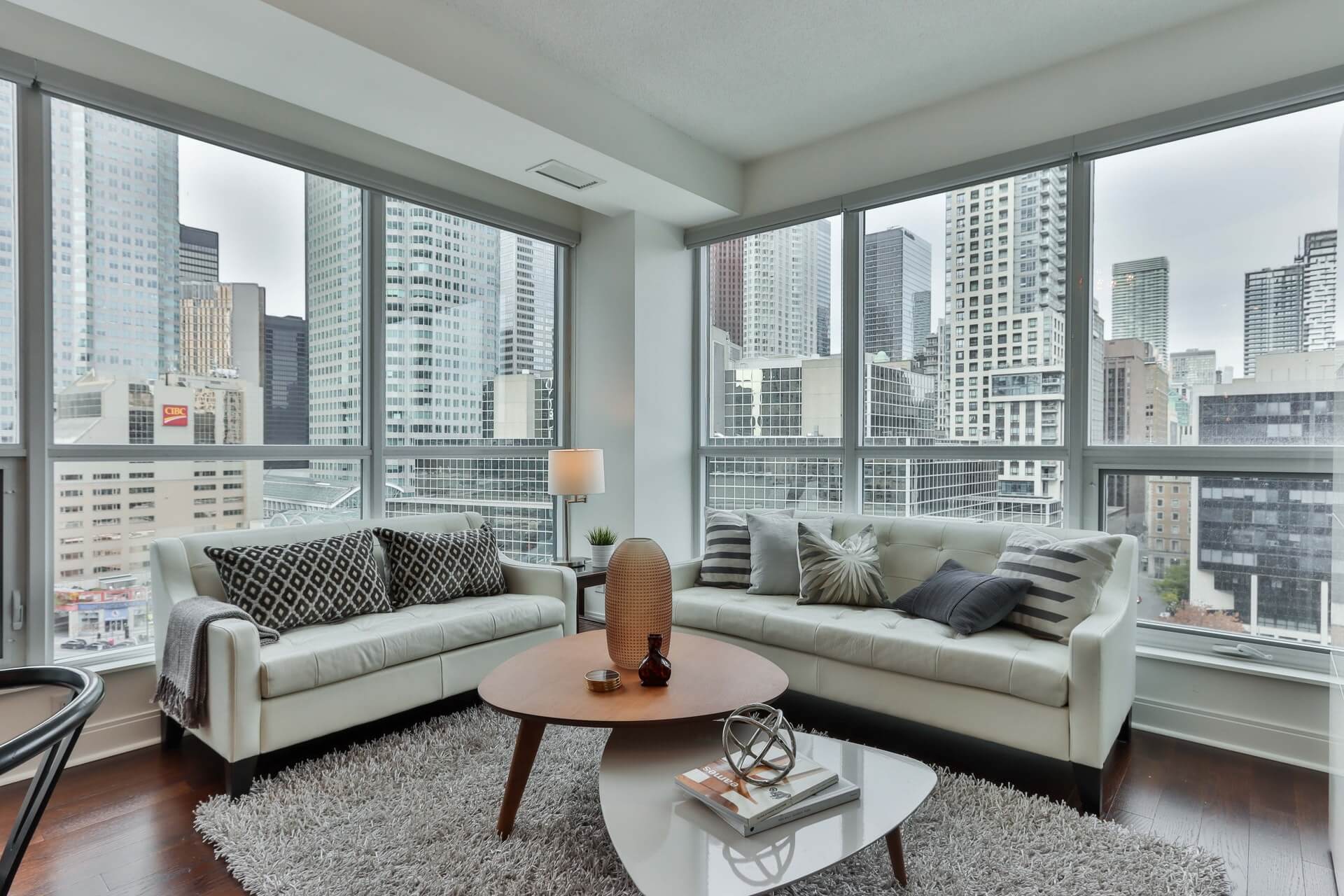 gray couch and brown wooden round table